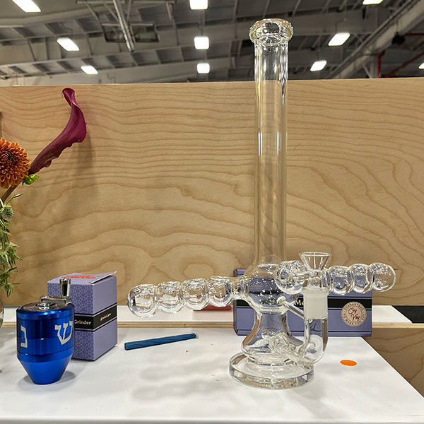 Weed Dude blessed by Tokin' Jews 8-bowl menorah,  dreidel grinder, shofar pipe and oh so many smarty canna-products! At Hall Of Flowers NYC Weed Dude blessed by Tokin' Jews 8-bowl menorah,  dreidel grinder, shofar pipe and oh so many smarty canna-products! At Hall Of Flowers NYC